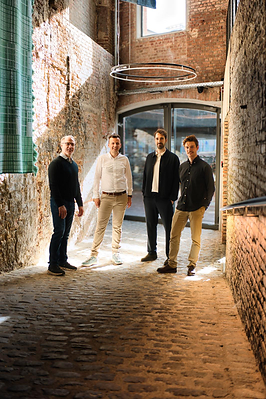 From left: Chris Huff (CEO, Adlib), Maarten Callaert (Co-Founder, Paperbox), Stijn Decubber (Co-Founder and CTO, Paperbox), Frederic Stallaert (Co-Founder, Paperbox)