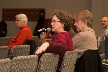 Photo of Nancy asking a question from audience.