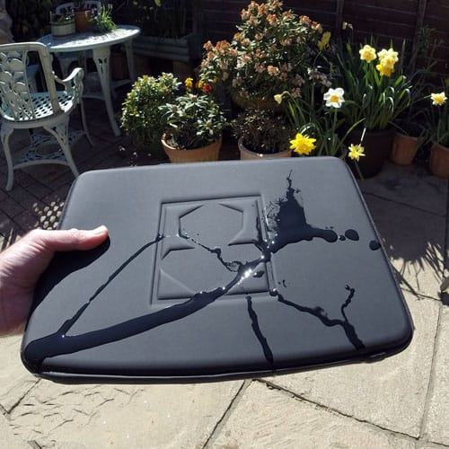 Water runs off PROHOOD A MNK Laptop case. MNK
