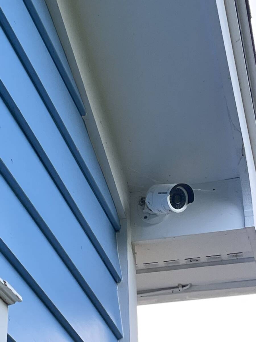 Bullet security camera mounted under an eave Bullet security camera mounted under an eave