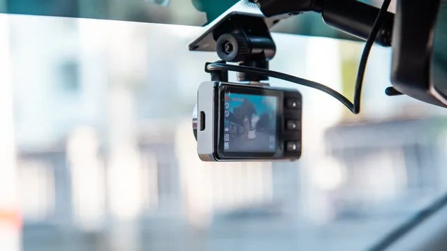 Dashcam camera installed on a vehicle windshield