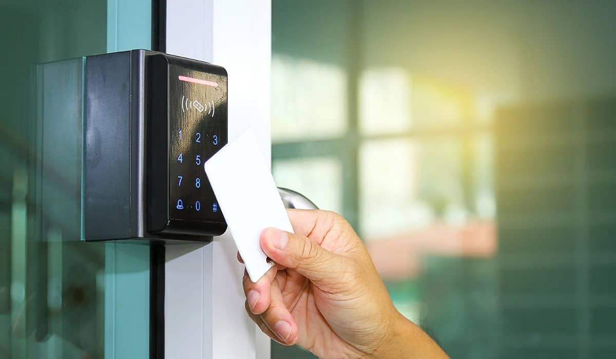 Keycard access control reader on a commercial glass door in NY, USA