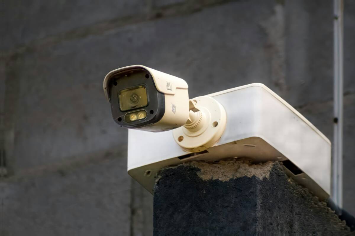 PoE security camera installed on a building exterior PoE security camera installed on a building exterior
