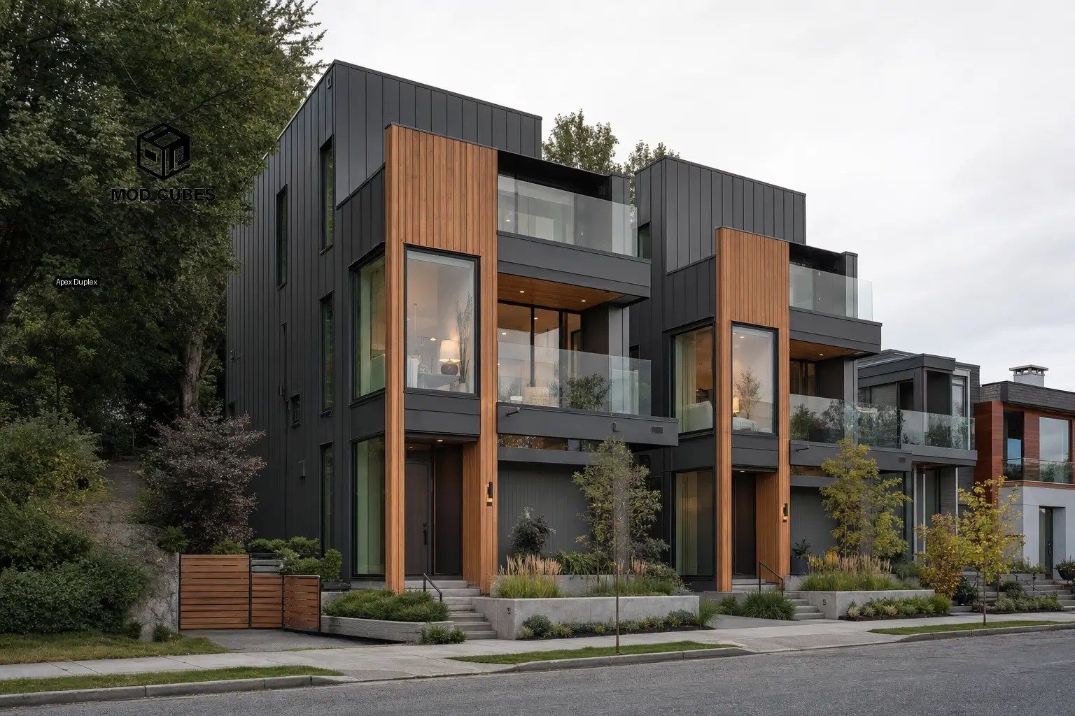 Multi-story modular home development with modern wood and gray exterior