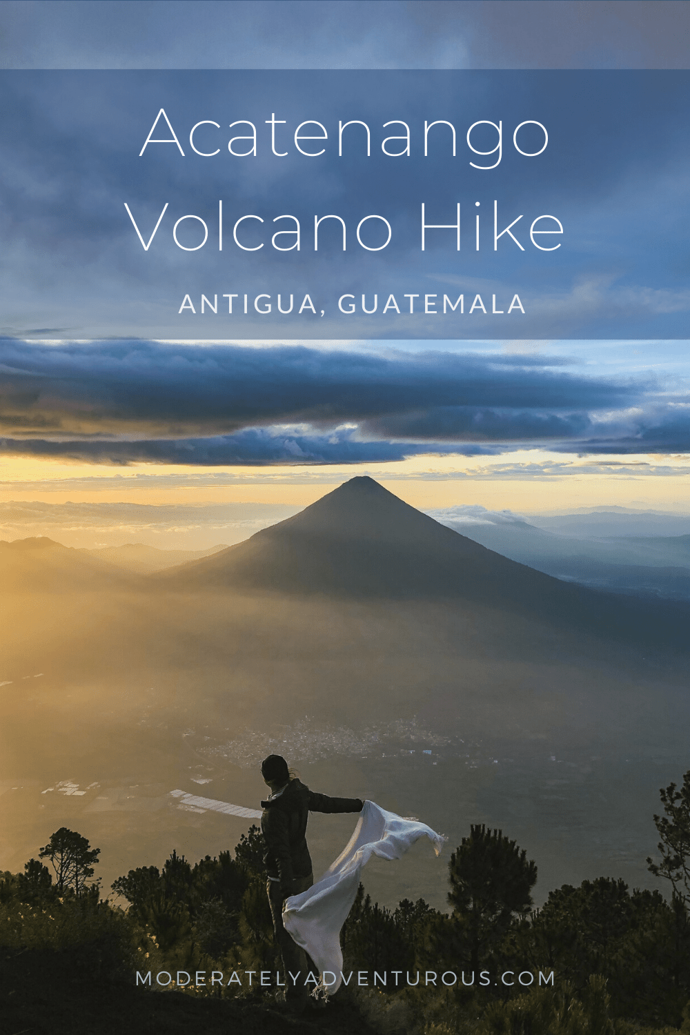 Hanna holding a white scarf in the wind, while the sun rises over the Augas Volcano in Guatemala. Text on the image reads, "Acatenango Volcano Hike, Antigua, Guatemala." Moderately Adventurous Travel