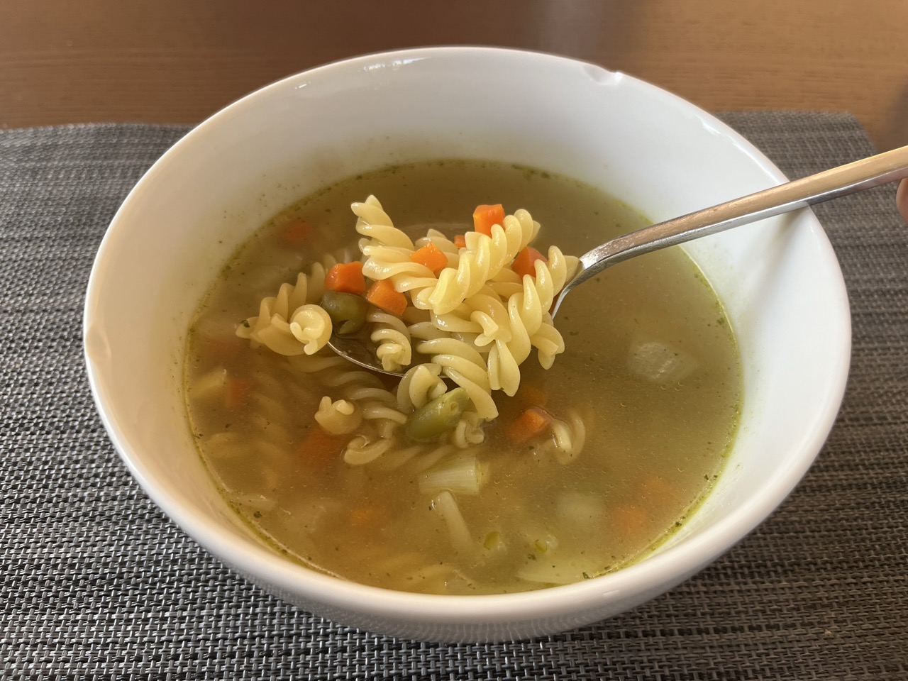 a white bowl with noodle soup easy recipes for seniors