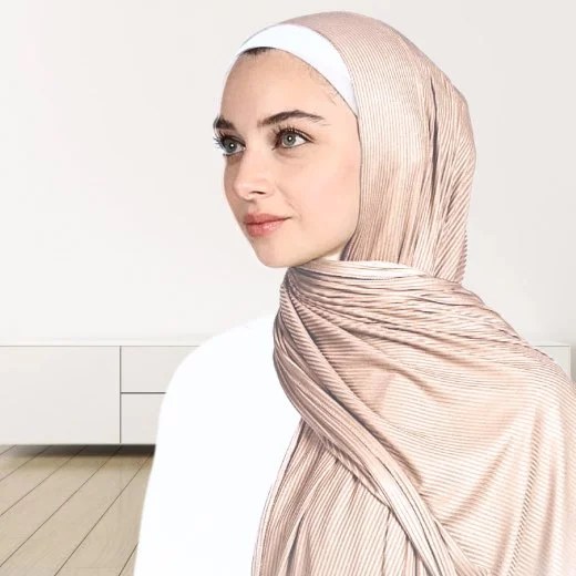 A woman wearing a draped ribbed jersey hijab. Modify.pk