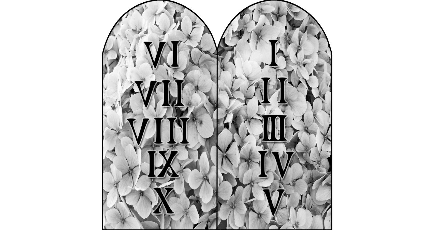 The ten commandment tablets with a floral background.