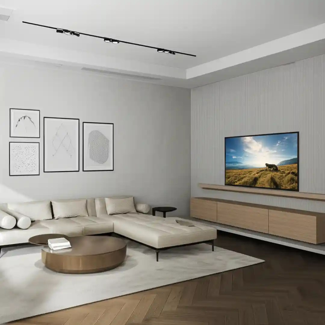 Modern living room with a beige sectional sofa, wooden TV unit, and minimalist decor, ideal for homes in Delhi, Gurgaon, and Noida.