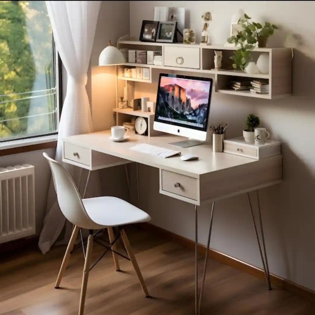 Modern home office desk with white top, metal legs, floating shelves, desktop, and window view — stylish minimalist workspace