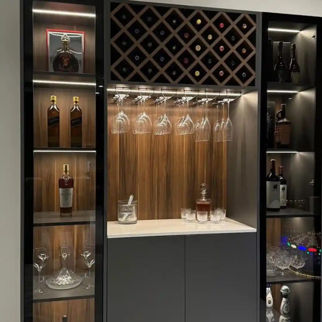 Modern home bar with wine rack and glass storage.