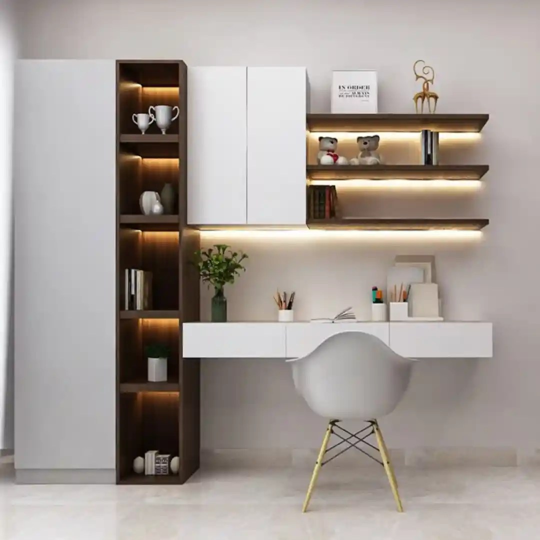 Modern study unit with floating desk, LED shelves, white cabinet, wooden accents, and gray chair — sleek home office design