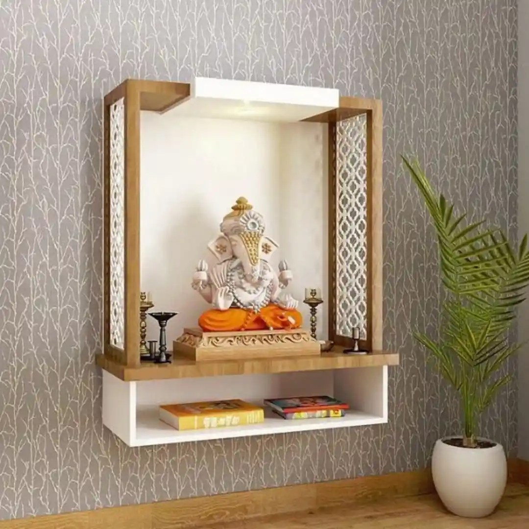 Wall-mounted temple with Ganesha idol and decorative lattice