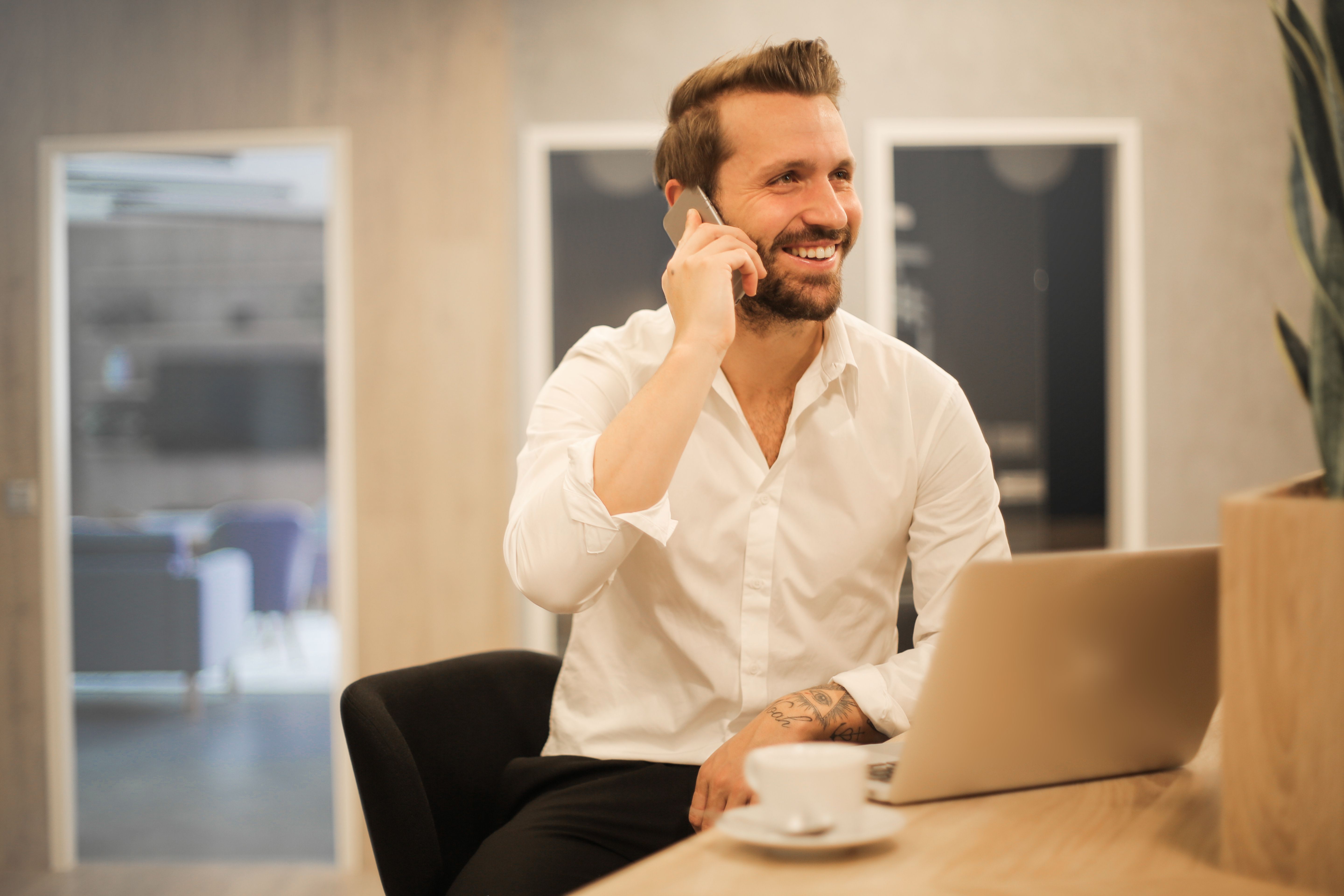Business professional on a phone call representing an AI answering service for small business