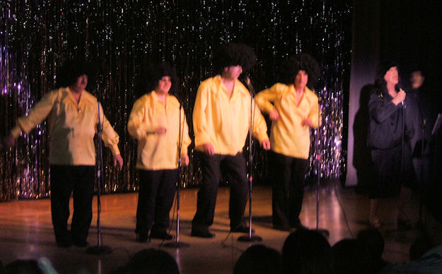 The Rotary's own all male version of Gladys Knight and the Pips sing the hit song "Midnight Train to Georgia."