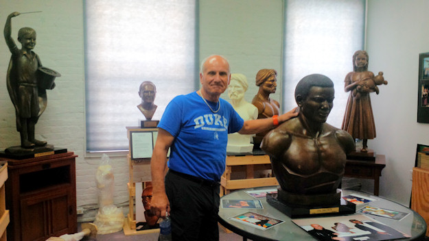 Morelli with a casting of a bust of athlete Jim Brown made for the Syracuse Football Hall of Fame