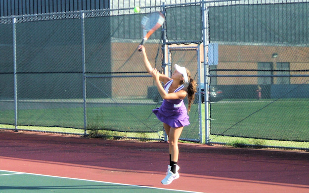 Kristie Kaczmarek serving