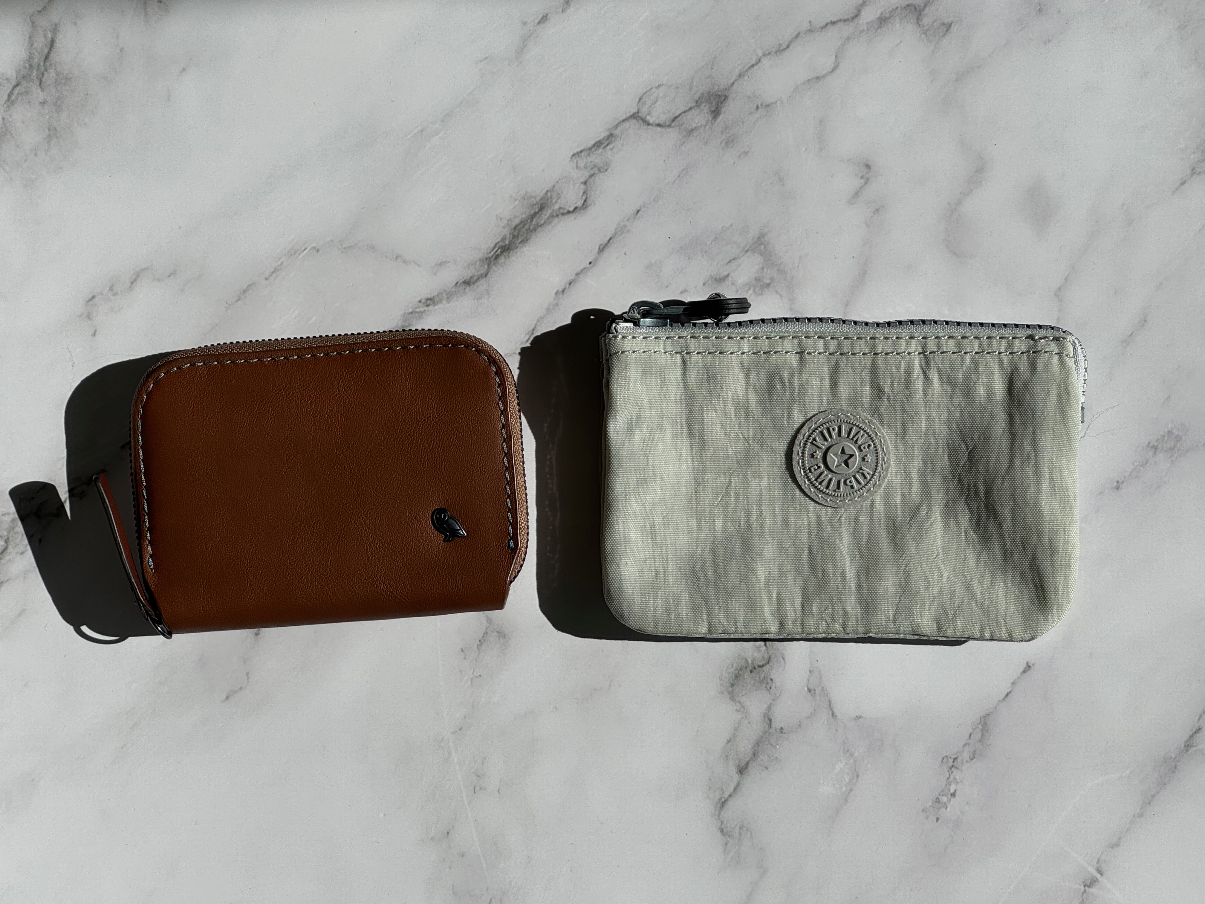 One Motion vs. Three Pockets: Bellroy Folio Mini vs. Kipling Creativity Small Pouch