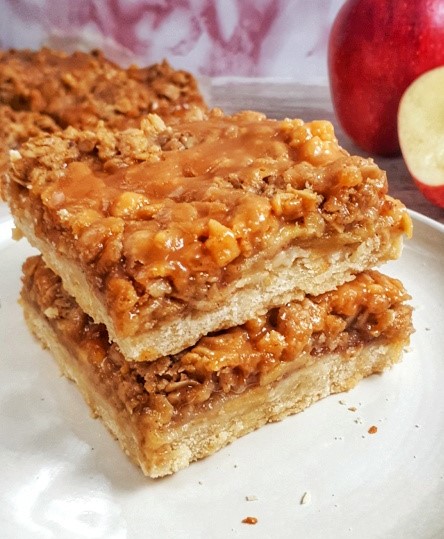 Paleo Apple Pie Crumb Bars are a delicious fall treat that combines a shortbread crust with apple pie and crumble topping. Perfect for holiday parties!