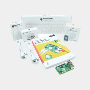 Contenu du kit Desktop Raspberry Pi 5 avec boîtier, clavier, câbles, guide du débutant et carte Pi 5