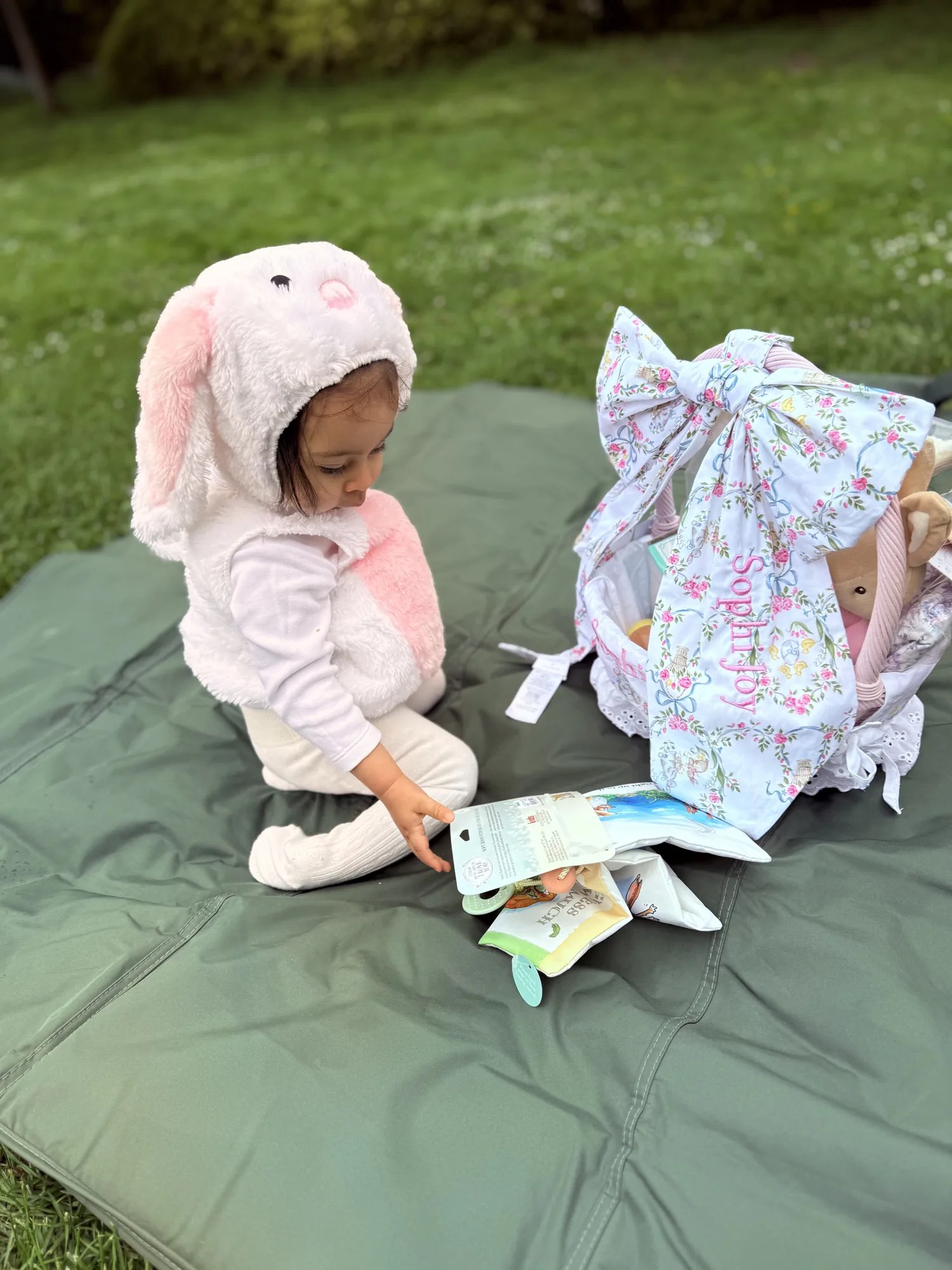 A toddler discovering her Easter basket