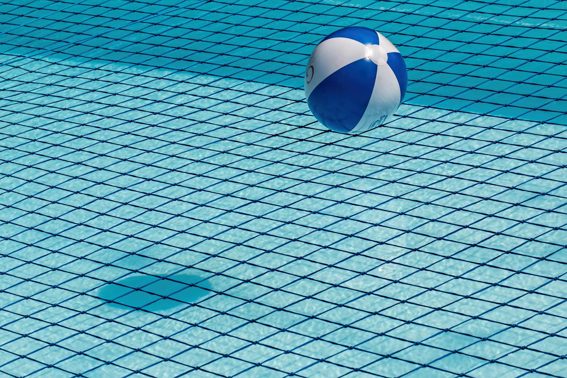 blue and white ball over water