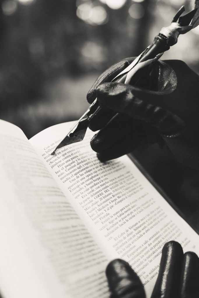artistic black and white writing scene with gloves