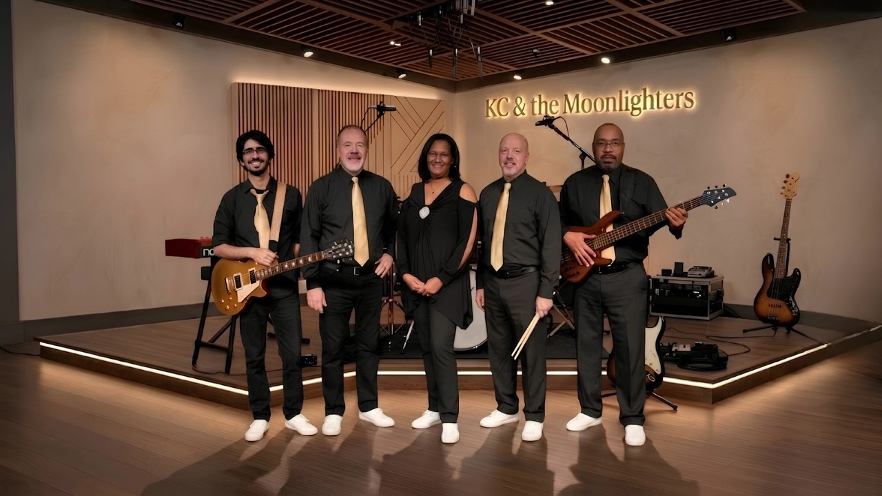 Corporate events Five band members wraring black shirts gold ties