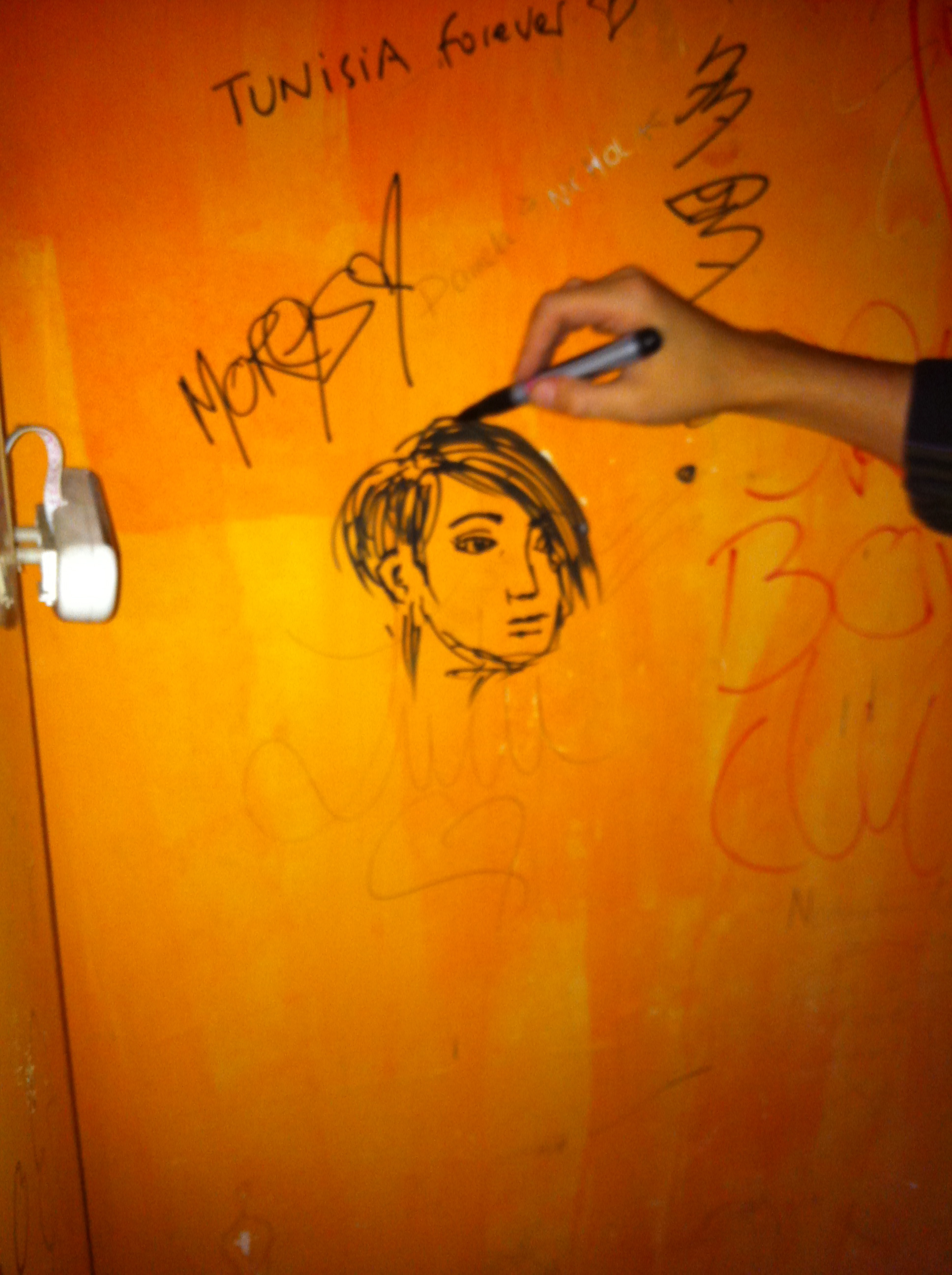 My face on a wall at Perrys Bar in Shanghai.