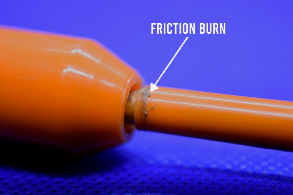 Plastic on bolt seal shaft showing friction burns from spinning attack