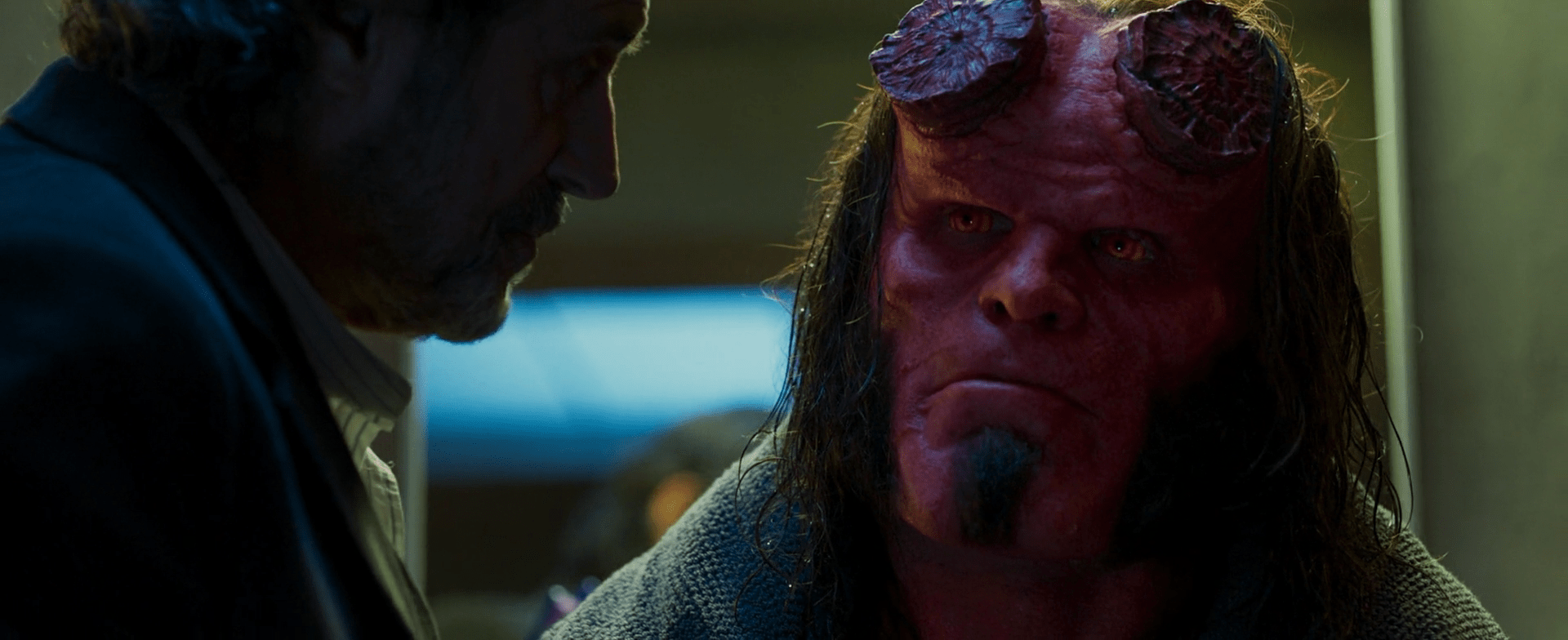Hellboy (David Harbour) and his adoptive father, Trevor (Ian McShane)