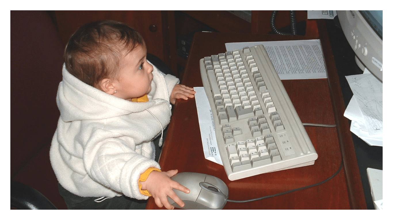 child writing on a computer