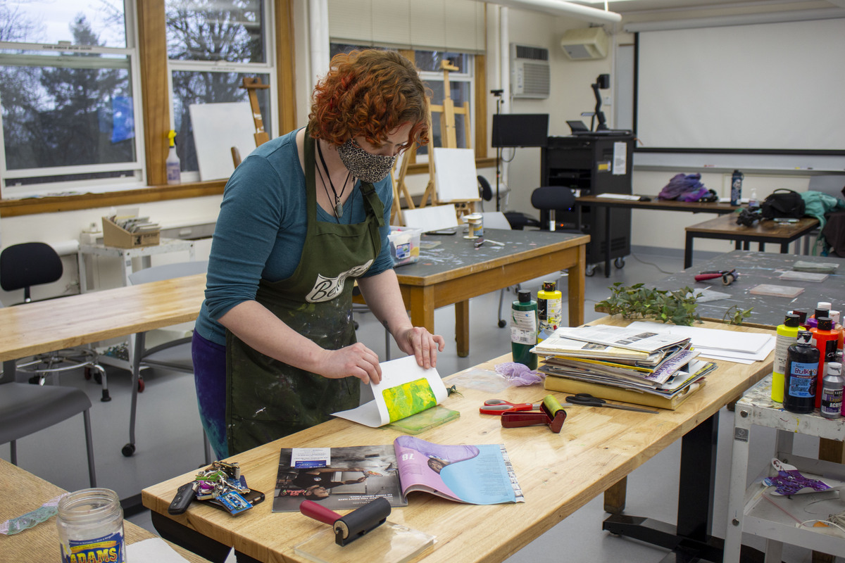 Photo of a person using materials in the art studio