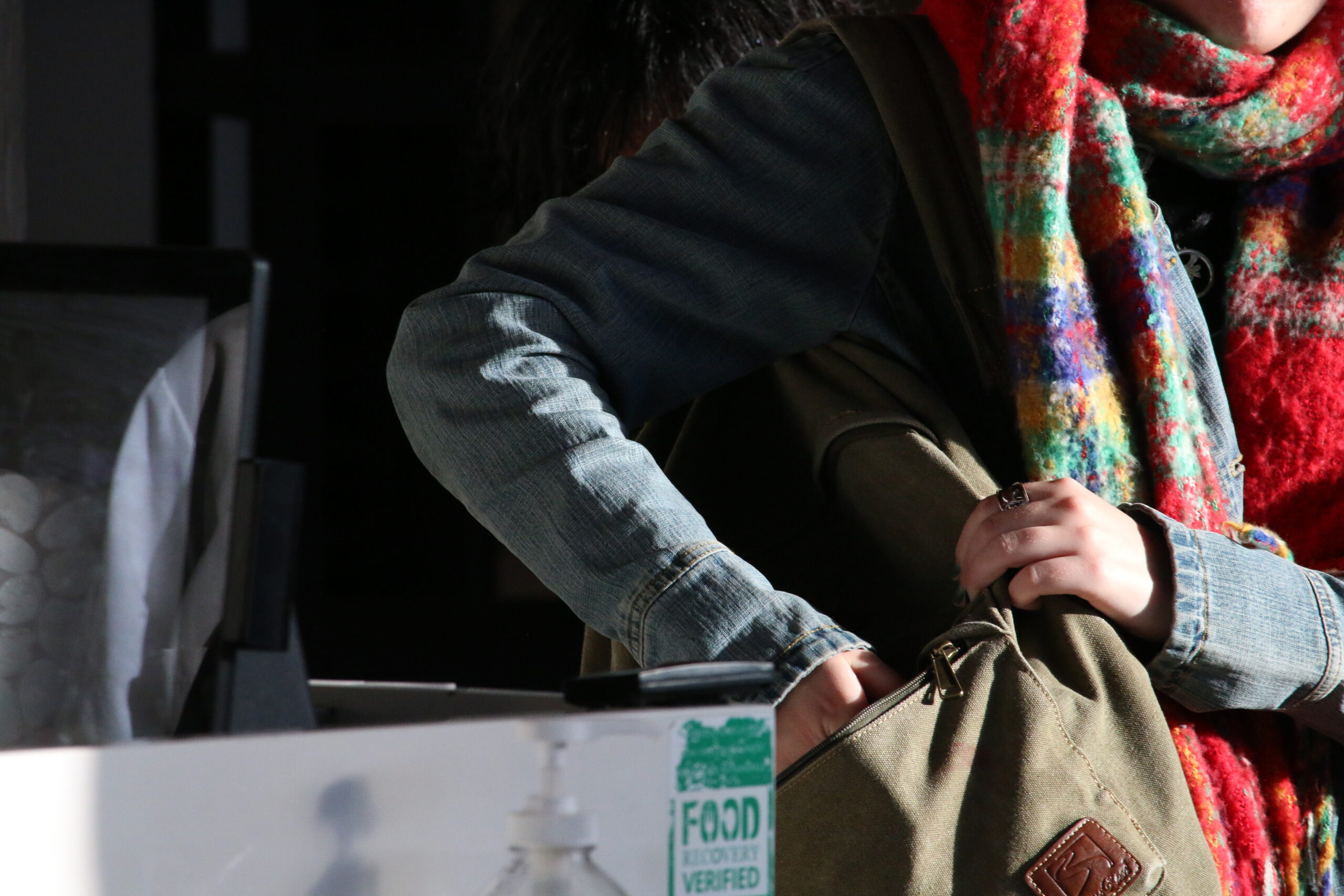 Photo of a person tapping into the Bon