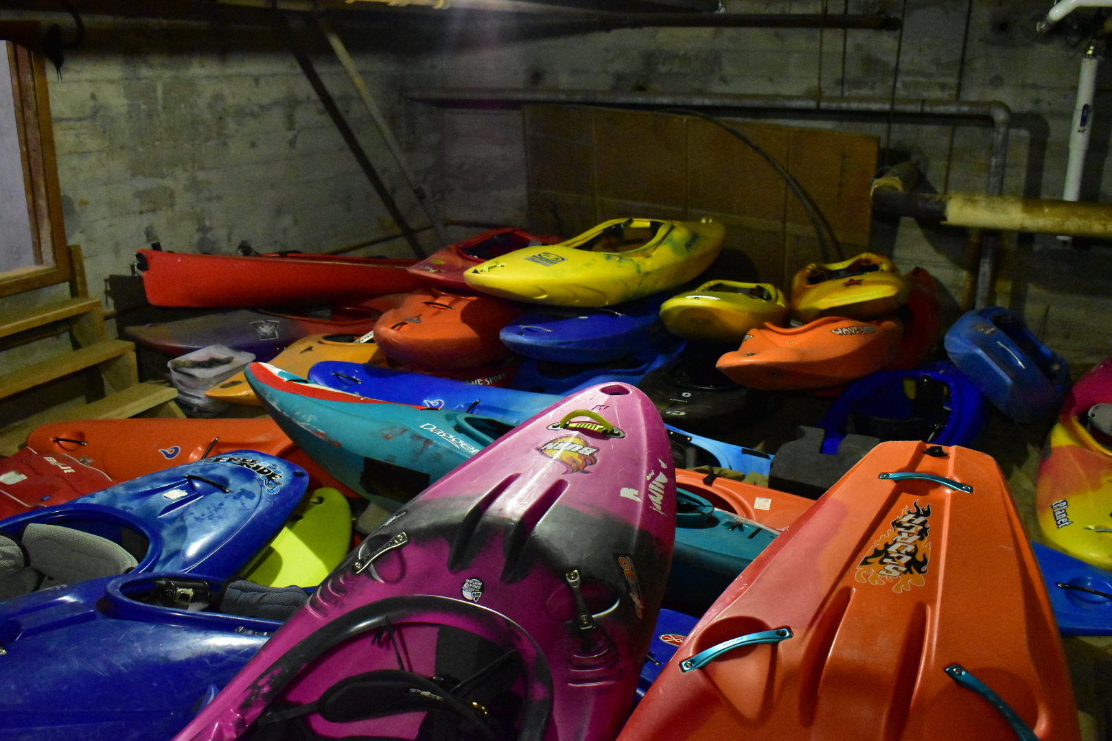 Photo of a large pile of kayaks