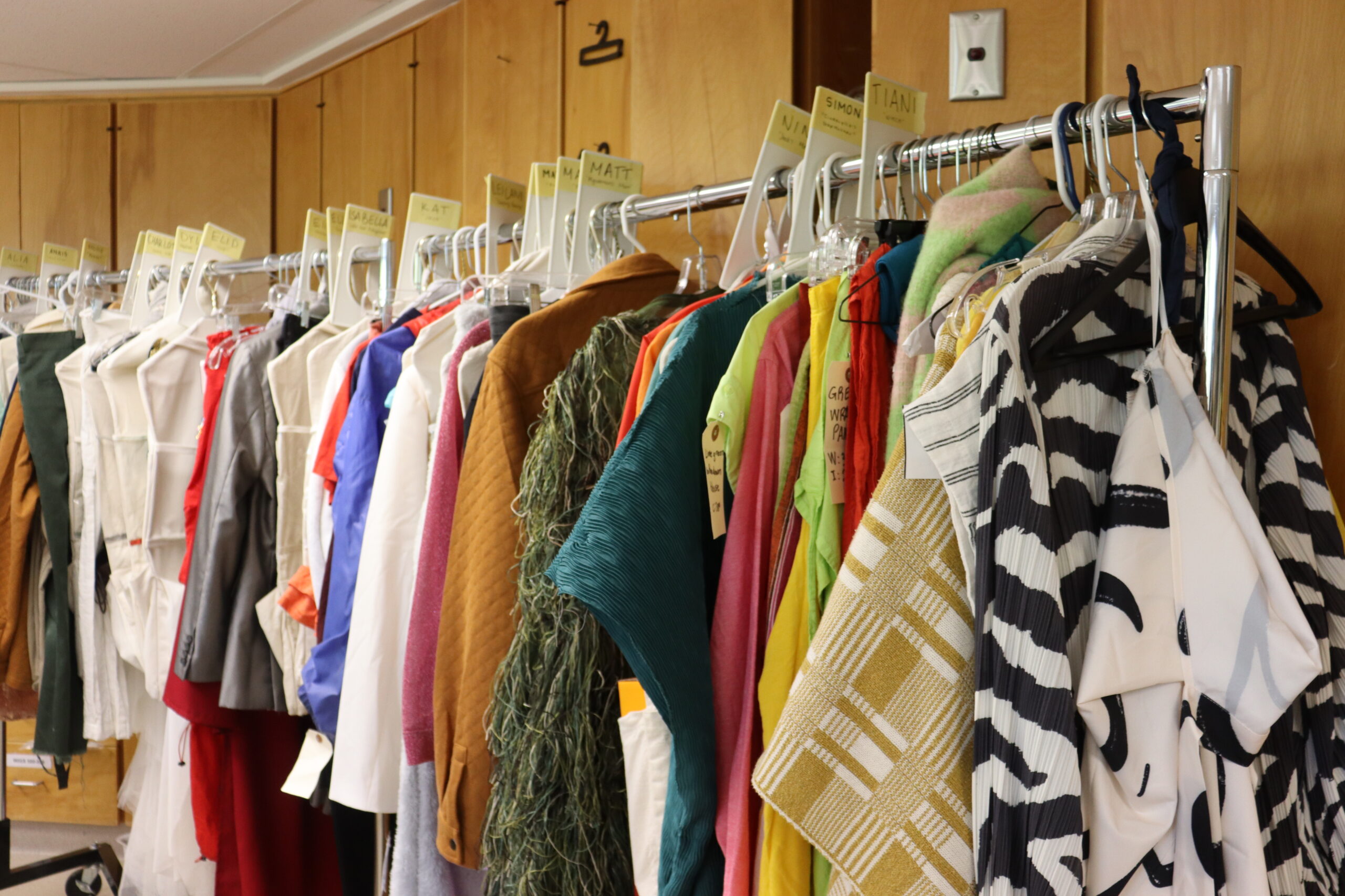 Costumes hanging on a rack.