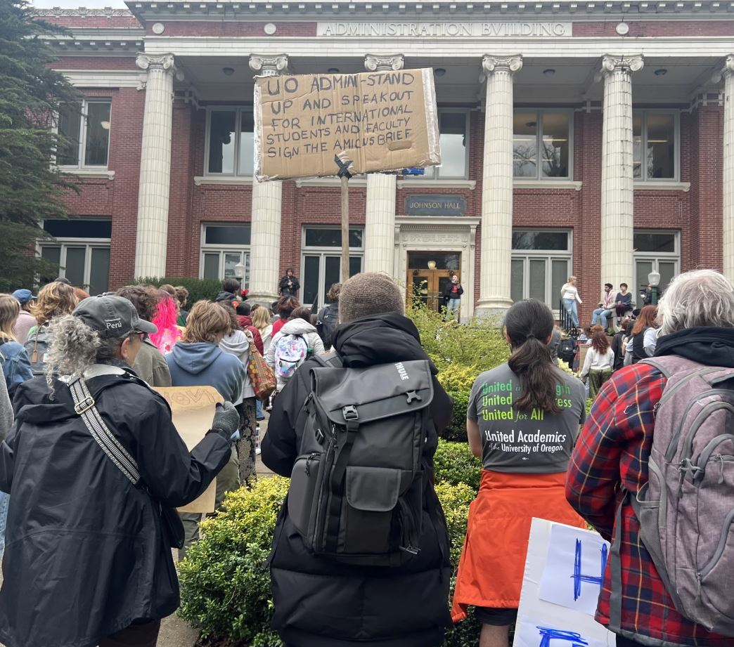 Protesters holding signs.
