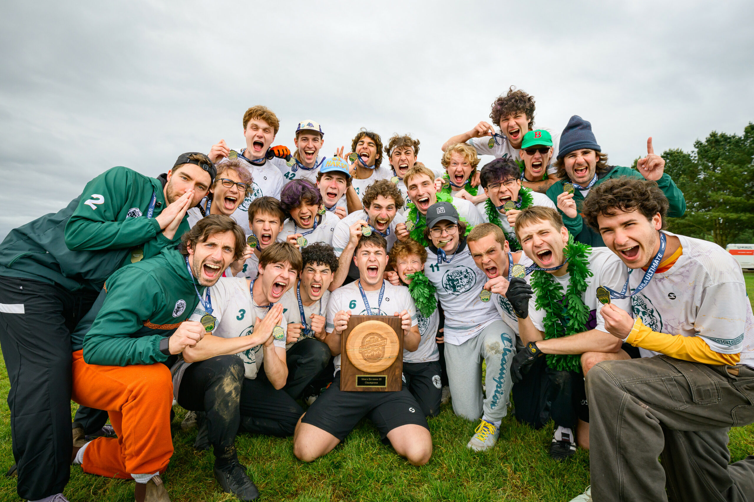 Team photo of Bacchus wearing medals and holding trophy