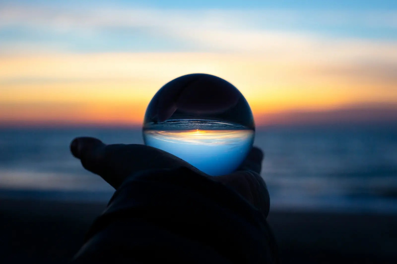Glass sphere at sunset representing future income and deferred compensation planning