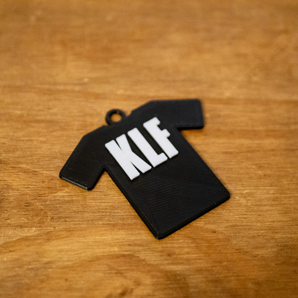 KLF Slogan Tee Shirt Keyring - 3D Printed in 2 colours - PLA 60mm (h) x 65mm (w) x 5mm (d)