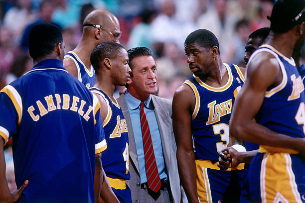 Head Coach Pat Riley leads Magic Johnson #32, Byron Scott #4, and Kareem Abdul-Jabbar #33 during a game played circa 1987 at the Veterans Memorial Coliseum in Portland, Oregon. NOTE TO USER: User expressly acknowledges and agrees that, by downloading and or using this photograph, User is consenting to the terms and conditions of the Getty Images License Agreement. Mandatory Copyright Notice: Copyright 1987 NBAE (Photo by Brian Drake/NBAE via Getty Images)