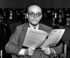 The International Military Tribunal was genuinely international. Each of the four principal Allied powers—the United States, United Kingdom, France, and Soviet Union—provided a judge and an alternate. British judge Lord Justice Geoffrey Lawrence served as president of the tribunal. The American judge was Francis Biddle, a former U.S. attorney general. France appointed Henri Donnedieu de Vabres. The Soviet Union appointed Major General Iona Nikitchenko. The multinational structure mattered. This was not simply an American military court imposing American law. The Allies were attempting to construct an international judicial mechanism for crimes that transcended national borders.