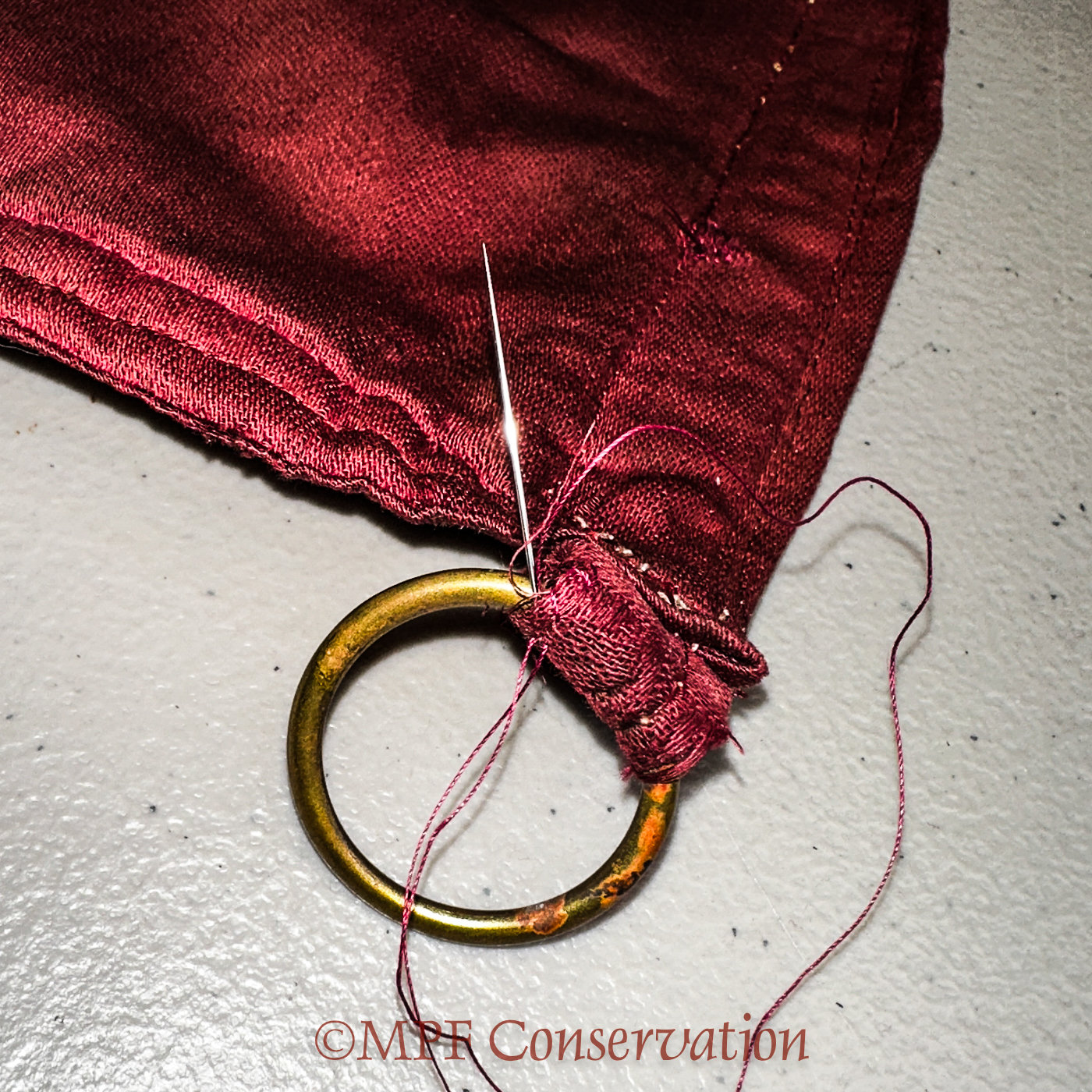 Frayed textiles stitched into place, before and...