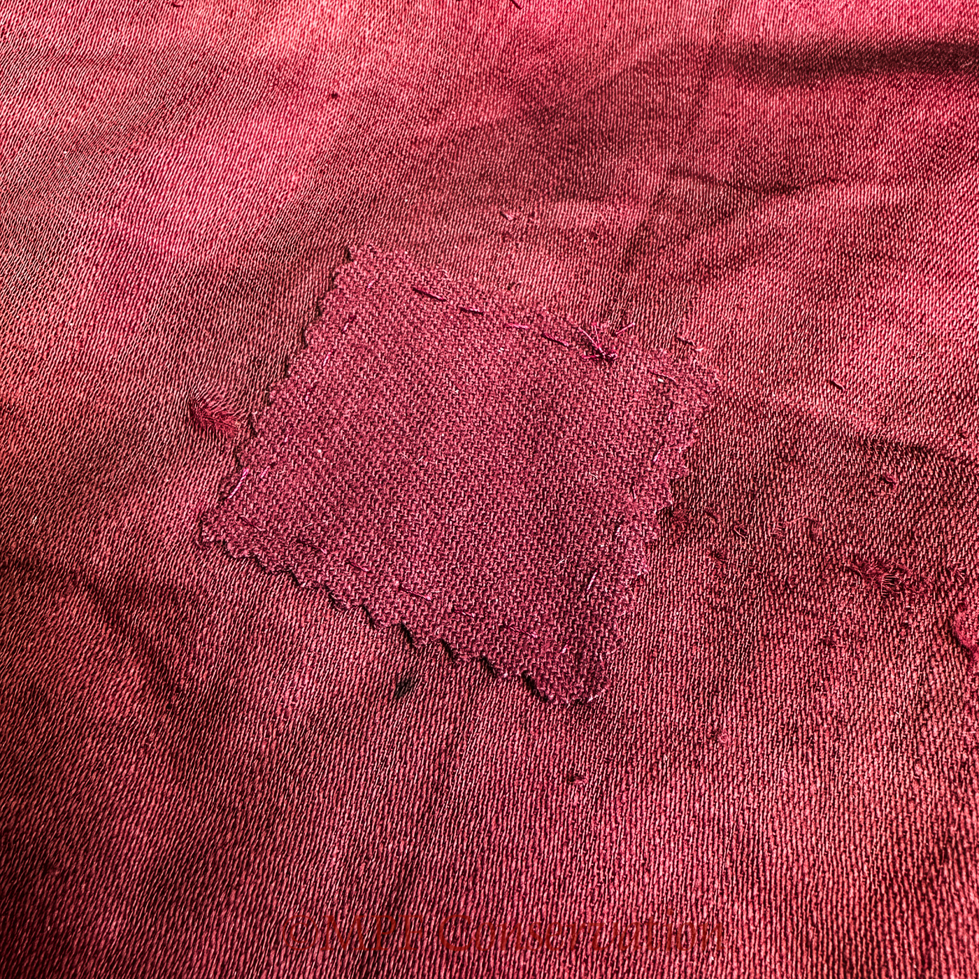 Rips on the back, example of patching.
