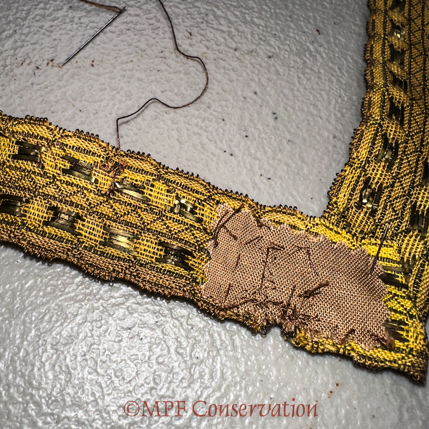 The backside of the corner with the fabric backing.