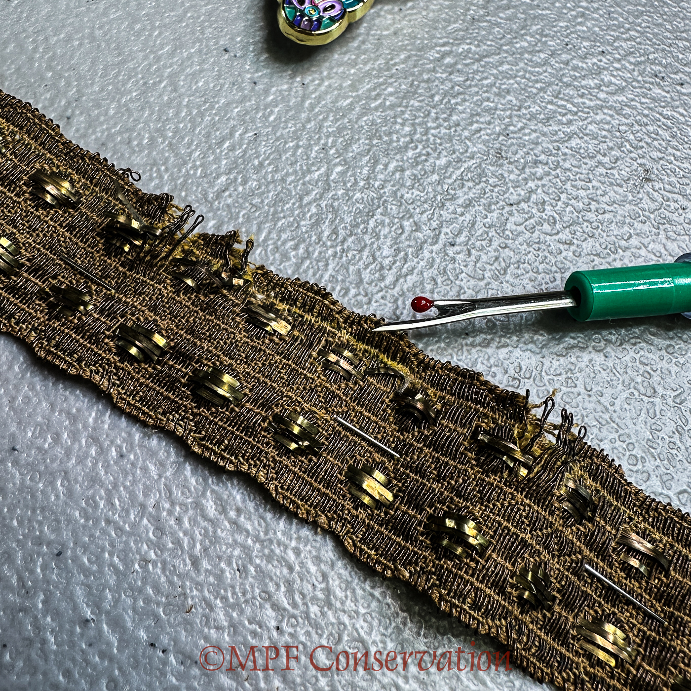 The saffron yellow top-stitching was a stabilizing repair...