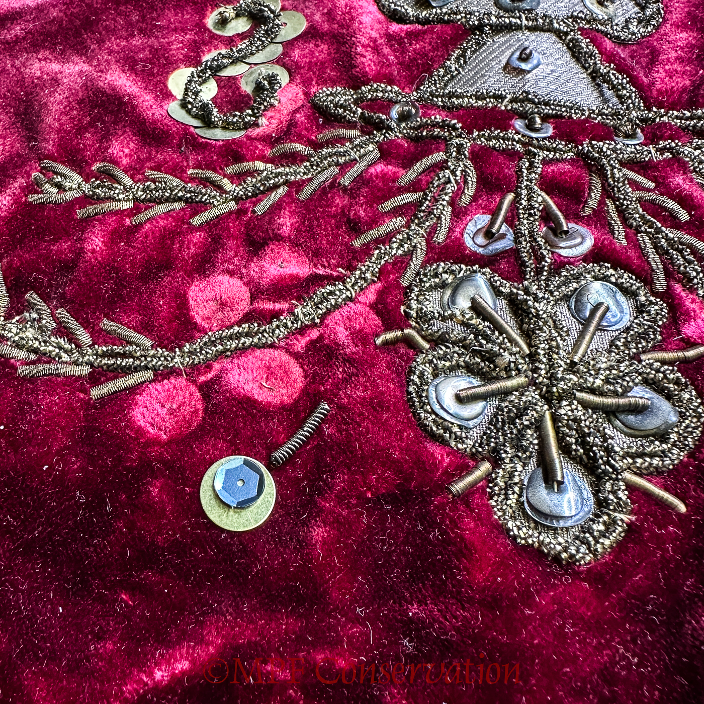 The charcoal satin sequin + new brass disc with a broken chain.