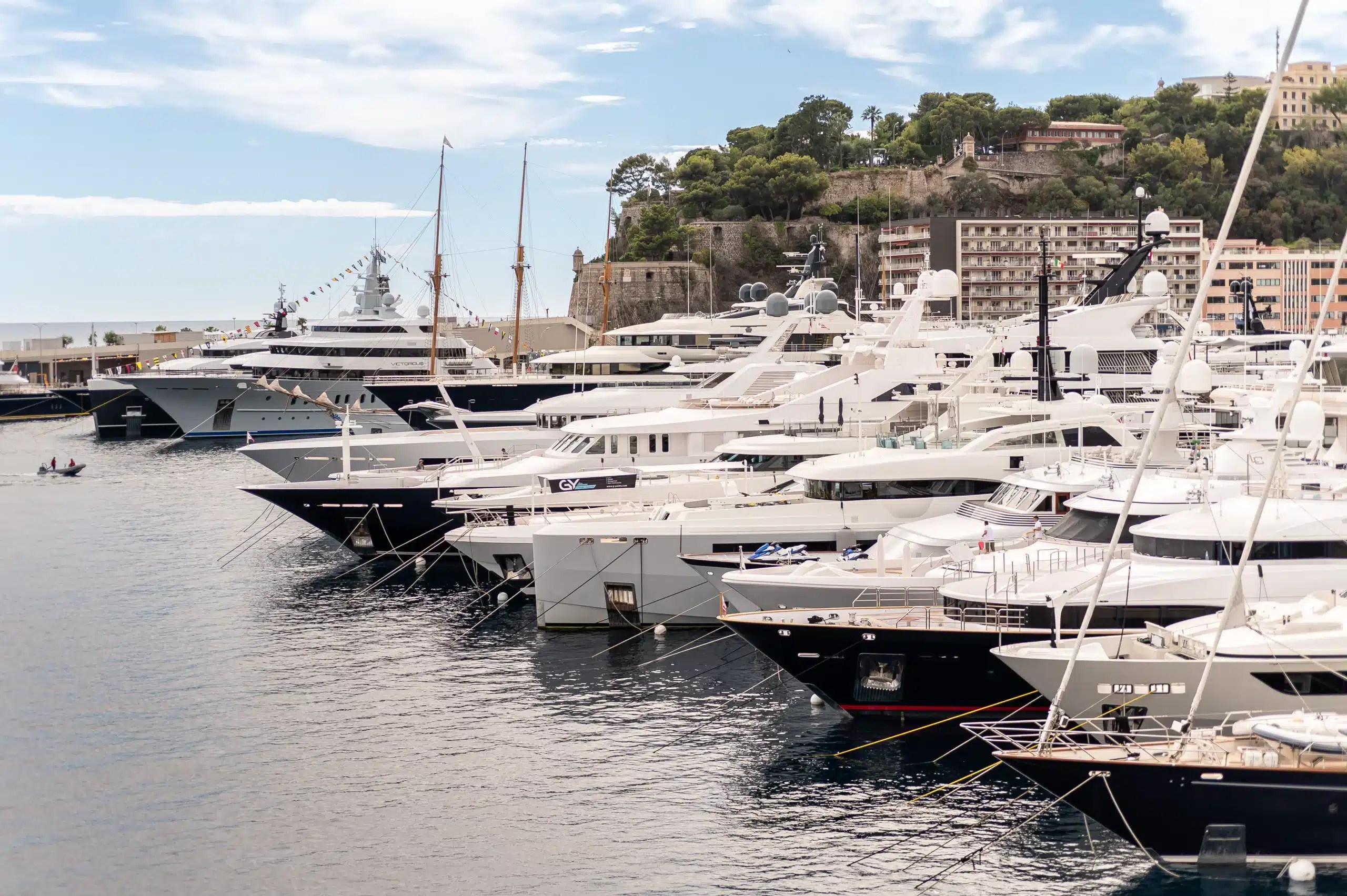 Superyachts at the Monaco Yacht Show, showcasing luxury, elegance, and the high-end lifestyle associated with Mr Wayne Eyewear.