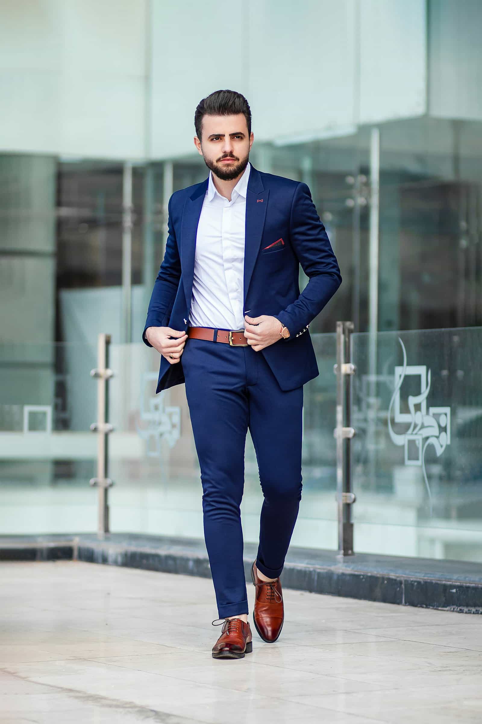 Dressing in your 40s and 50s — man in a well-fitted navy blazer and wool trousers