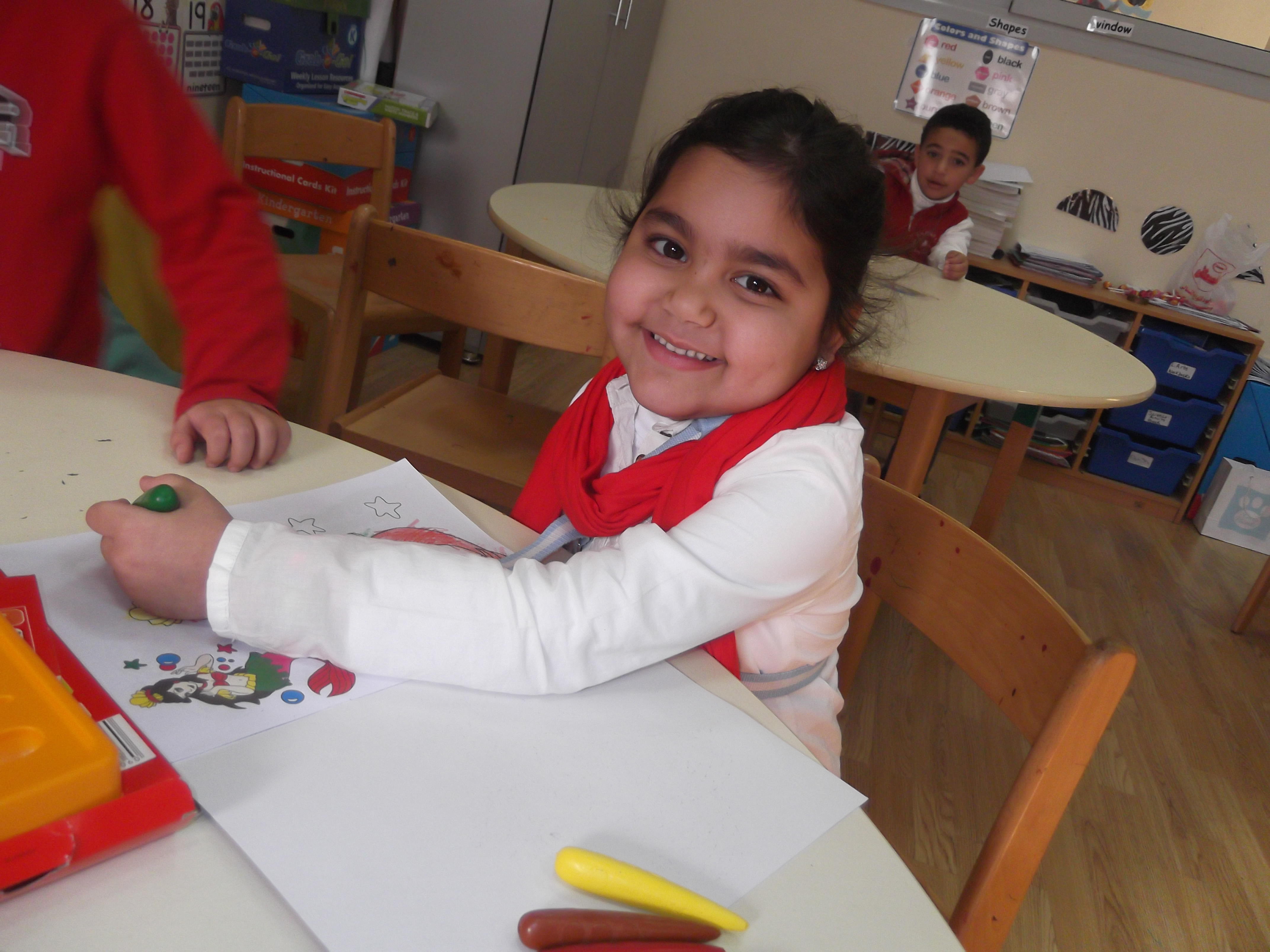 She loved her new crayons a coloring book from her friends